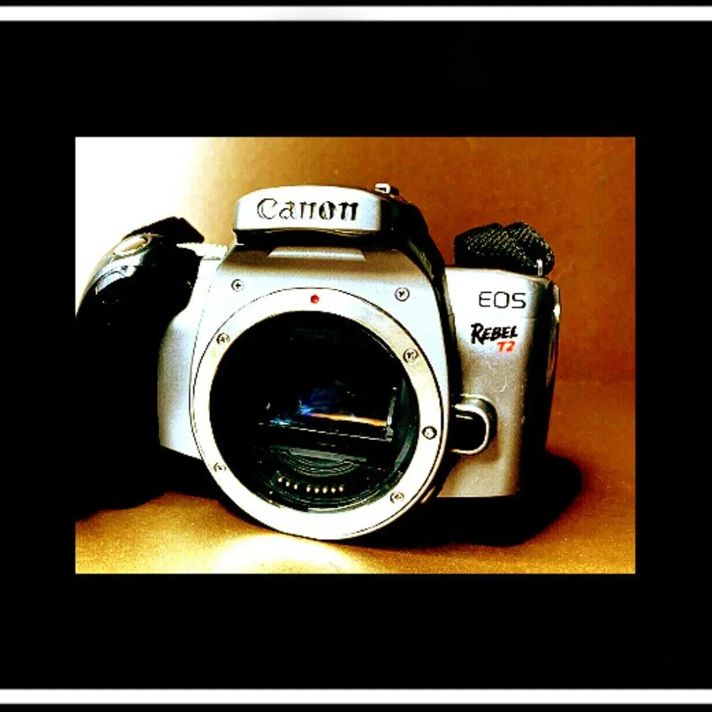 Canon Rebel EOS T2 Photography Camera With An Original Canon Camera Strap